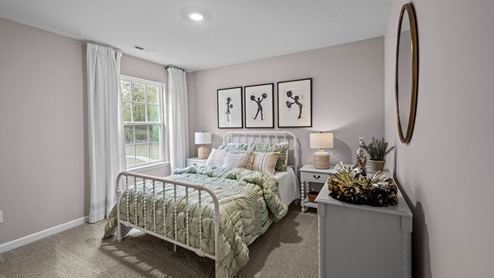 Bedroom with carpet flooring and windows