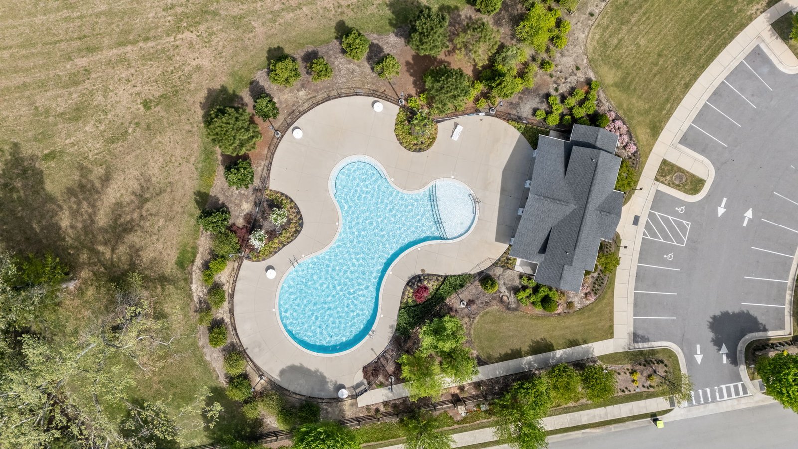 aerial view of community pool and pool house