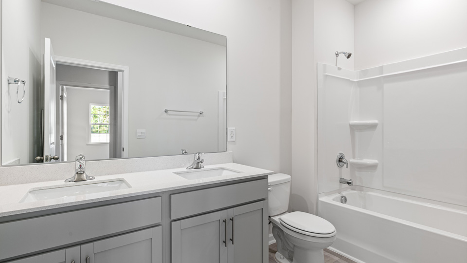 bathroom with quartz counters