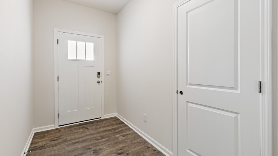 entryway with white door