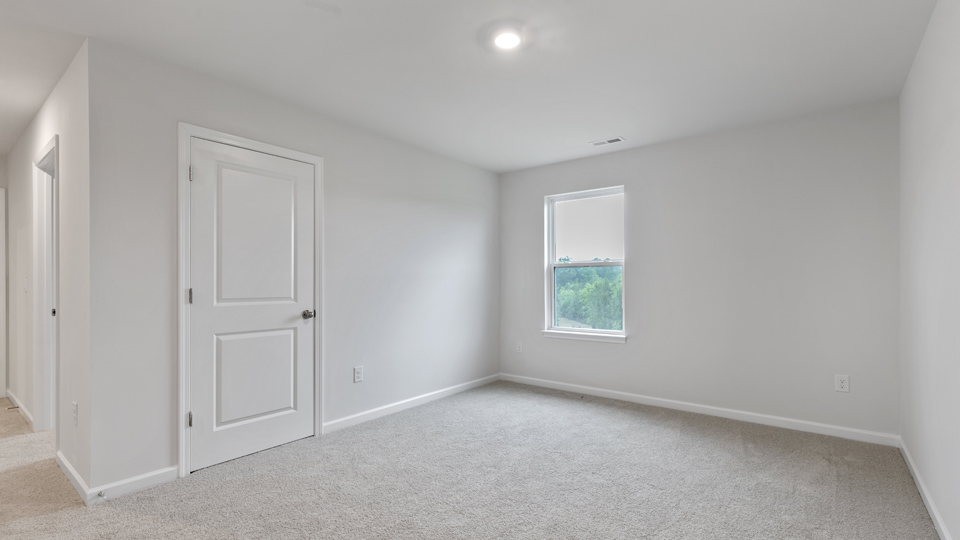 Bedroom with carpet flooring