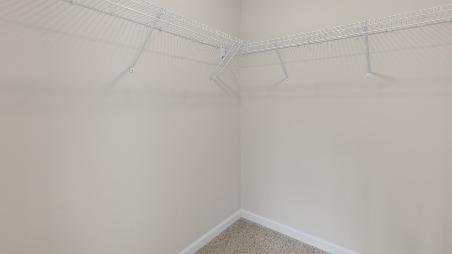 Walk in closet with built in wire shelving
