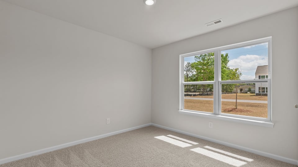 Bedroom with carpet flooring