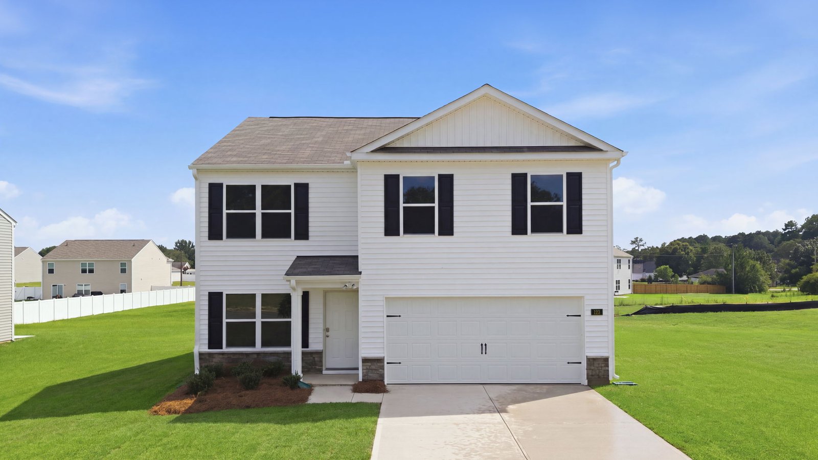 front exterior view of two story home with two car garage