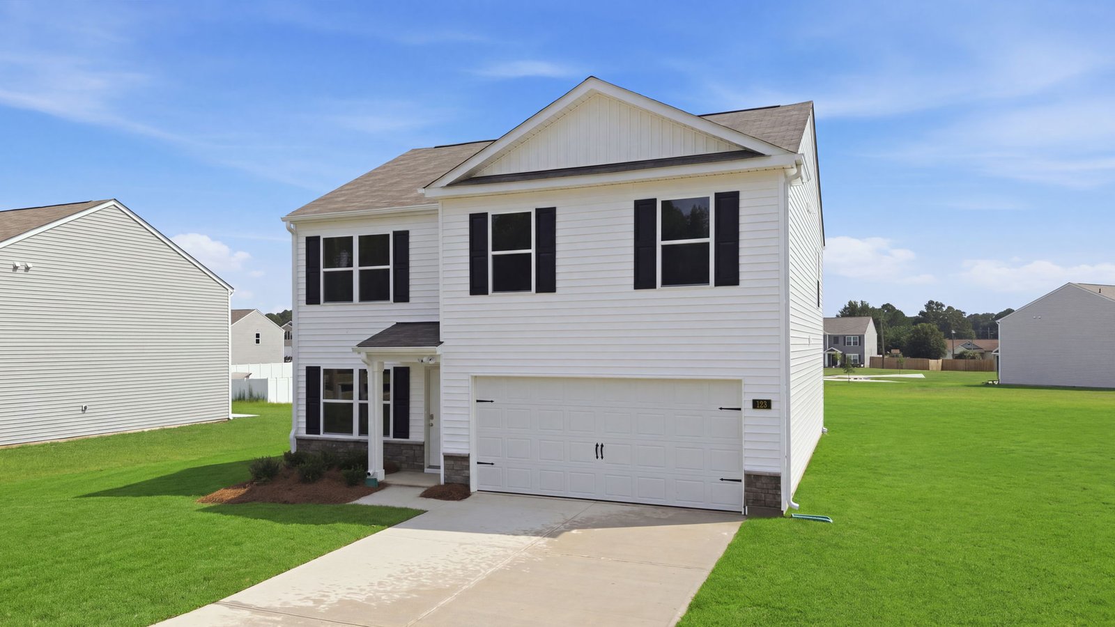 front exterior view of two story home with two car garage