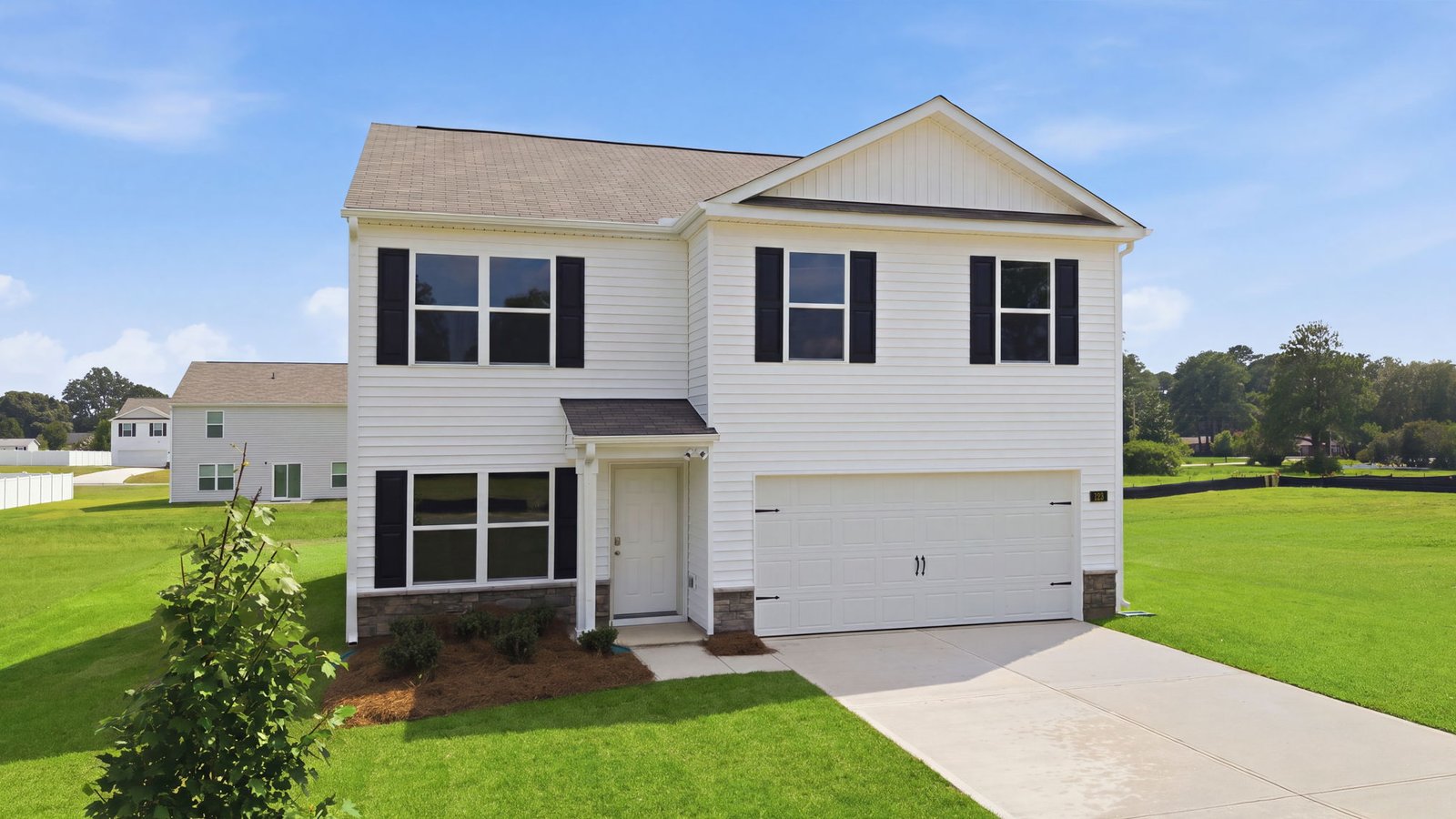 front exterior view of two story home with two car garage