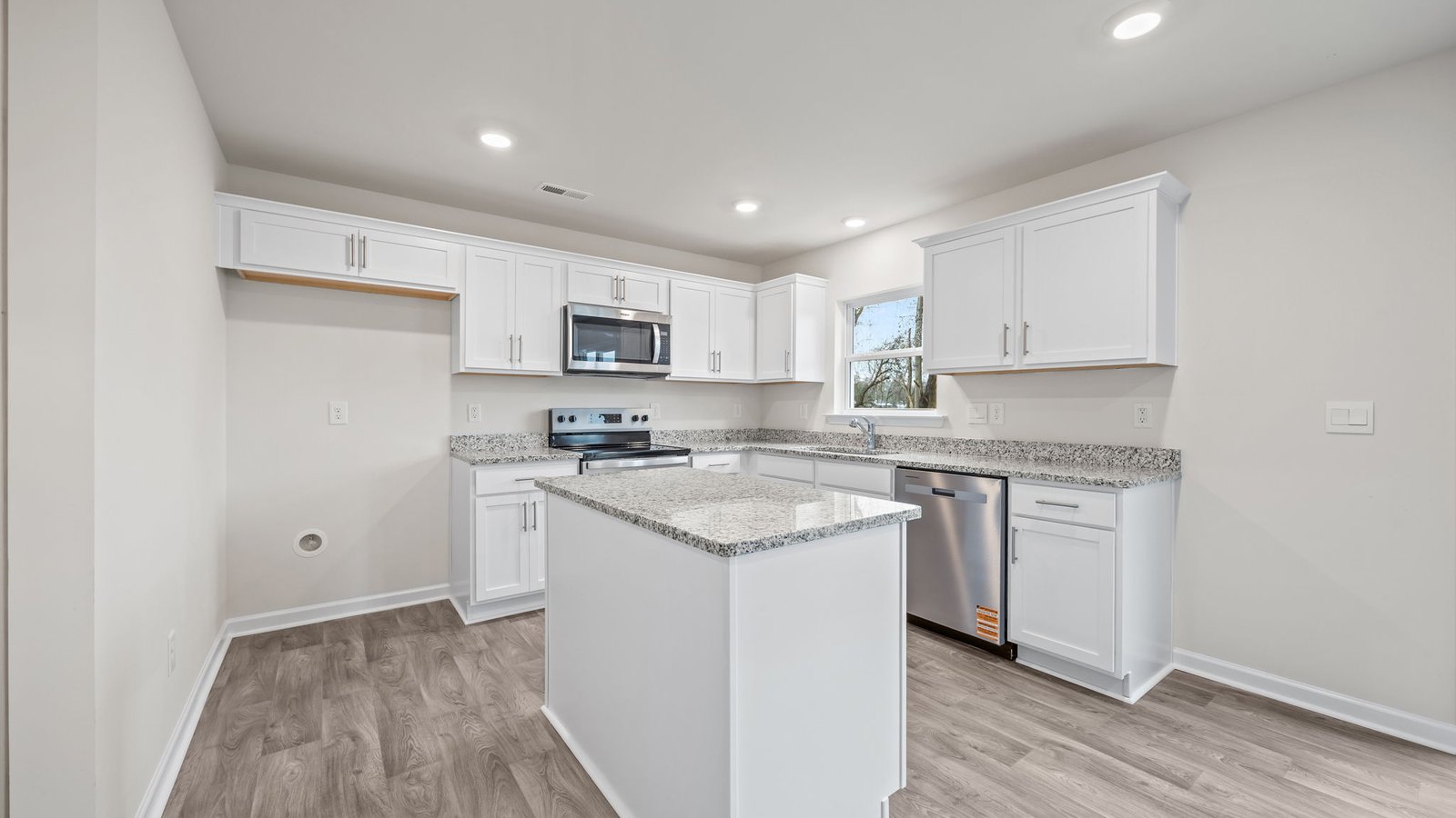 kitchen with island and stainless steelappliances