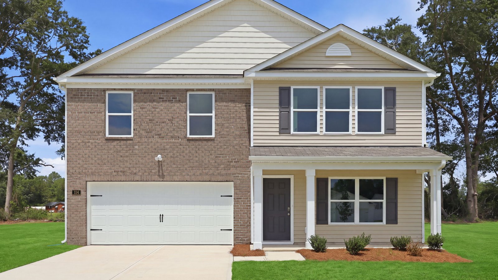 exterior of the home two story with two car garage