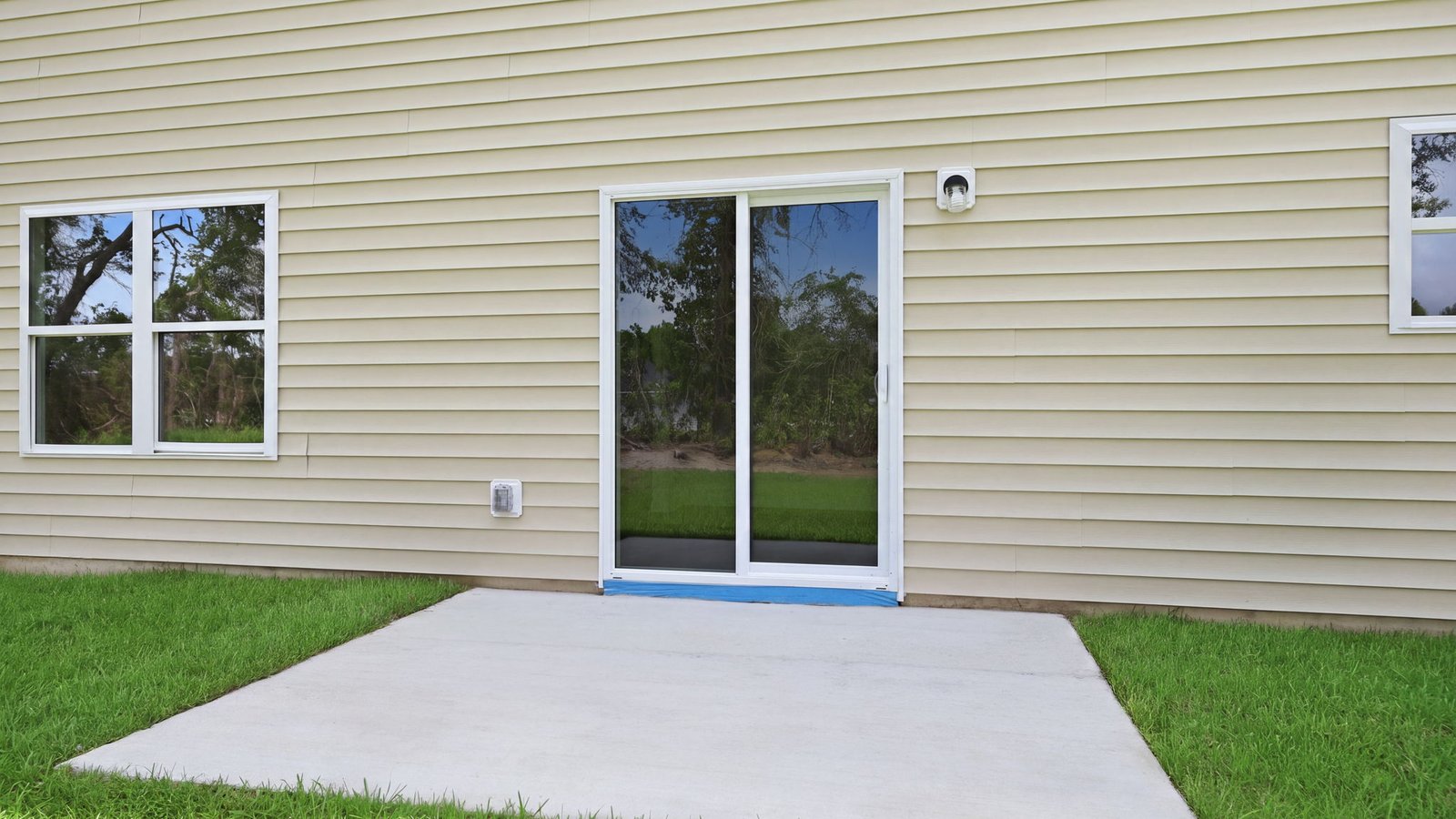 rear view of home and back patio pad