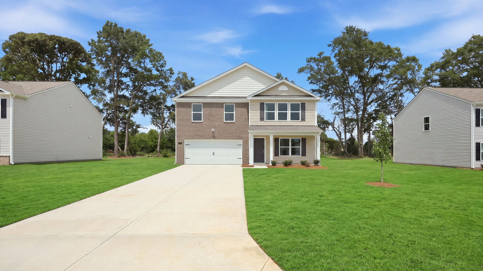 driveway with exterior of home with two car garage