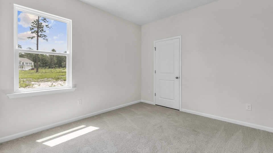 Bedroom with carpet flooring