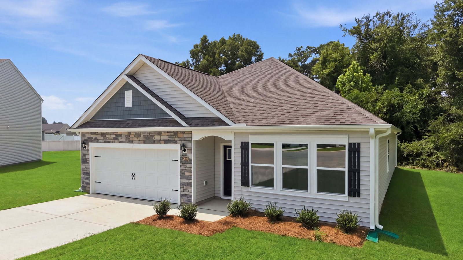 exterior of two story home with two car garage