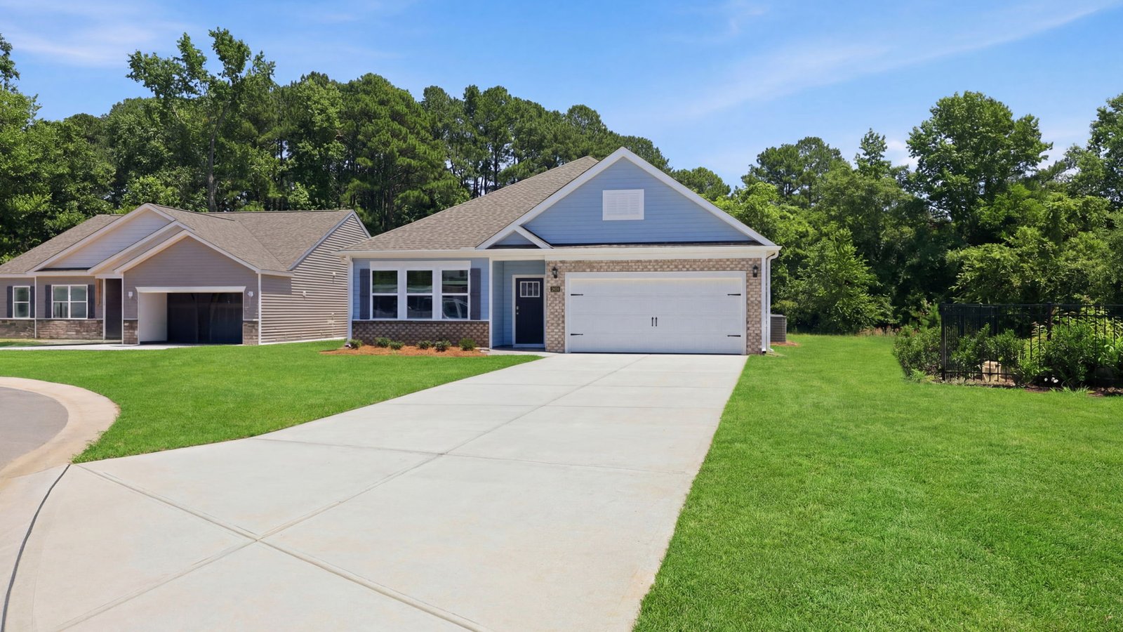 front view of home with driveway and two car garage