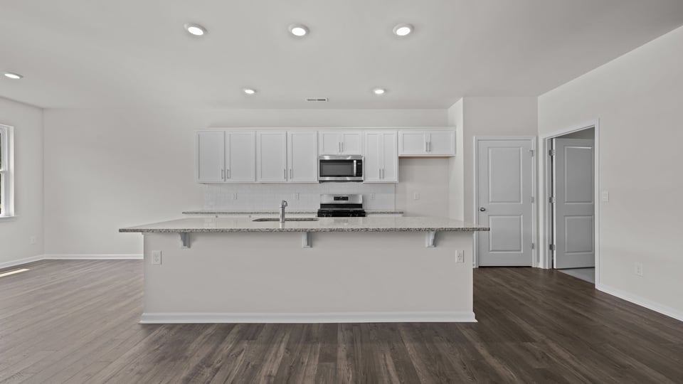 view of kitchen island and open concept living space