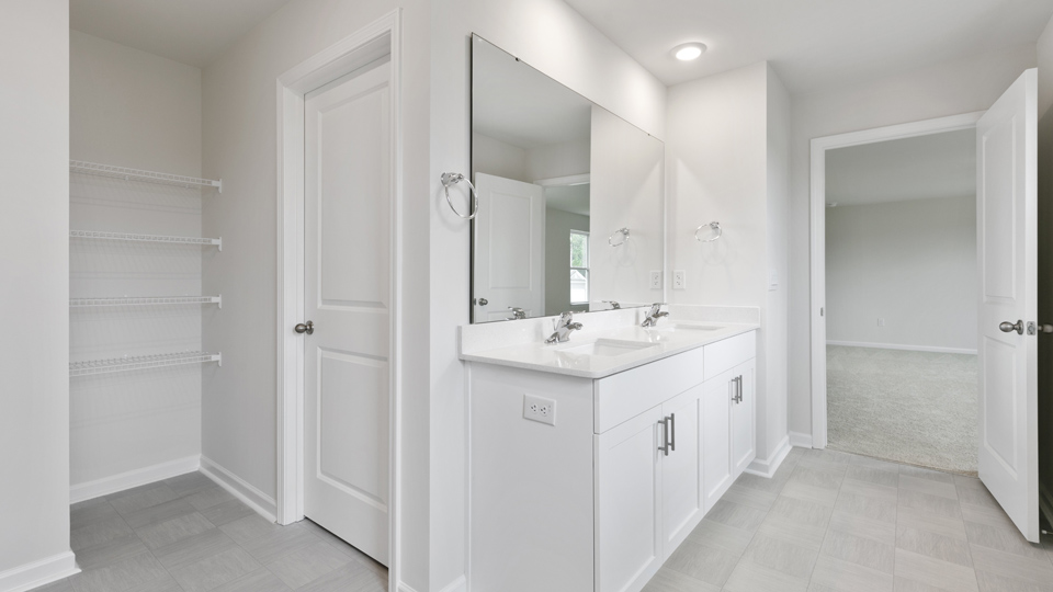 Bathroom with white cabinets