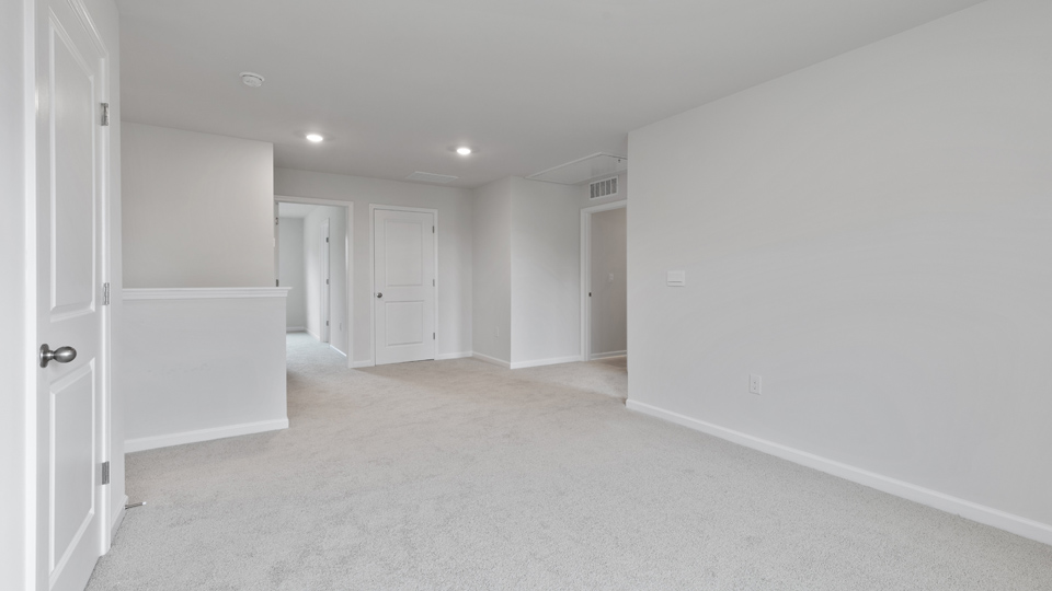 Loft area with carpet