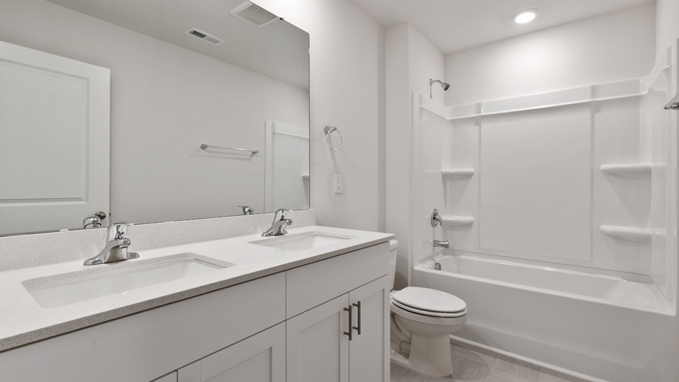 Bathroom with white cabinets
