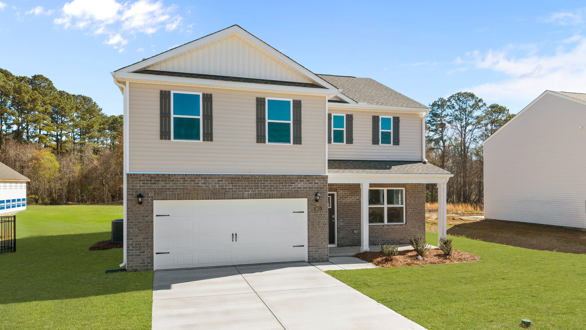Large two car garage with covered front porch