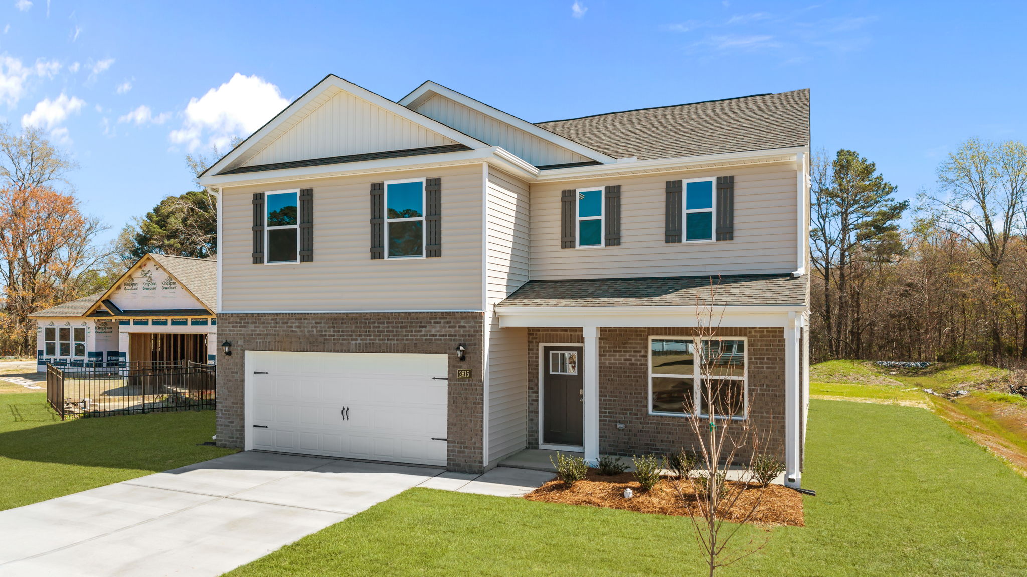 Two story home with two car garage and covered front porch