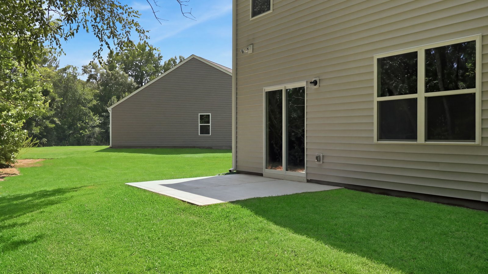 view of back yard and patio pad