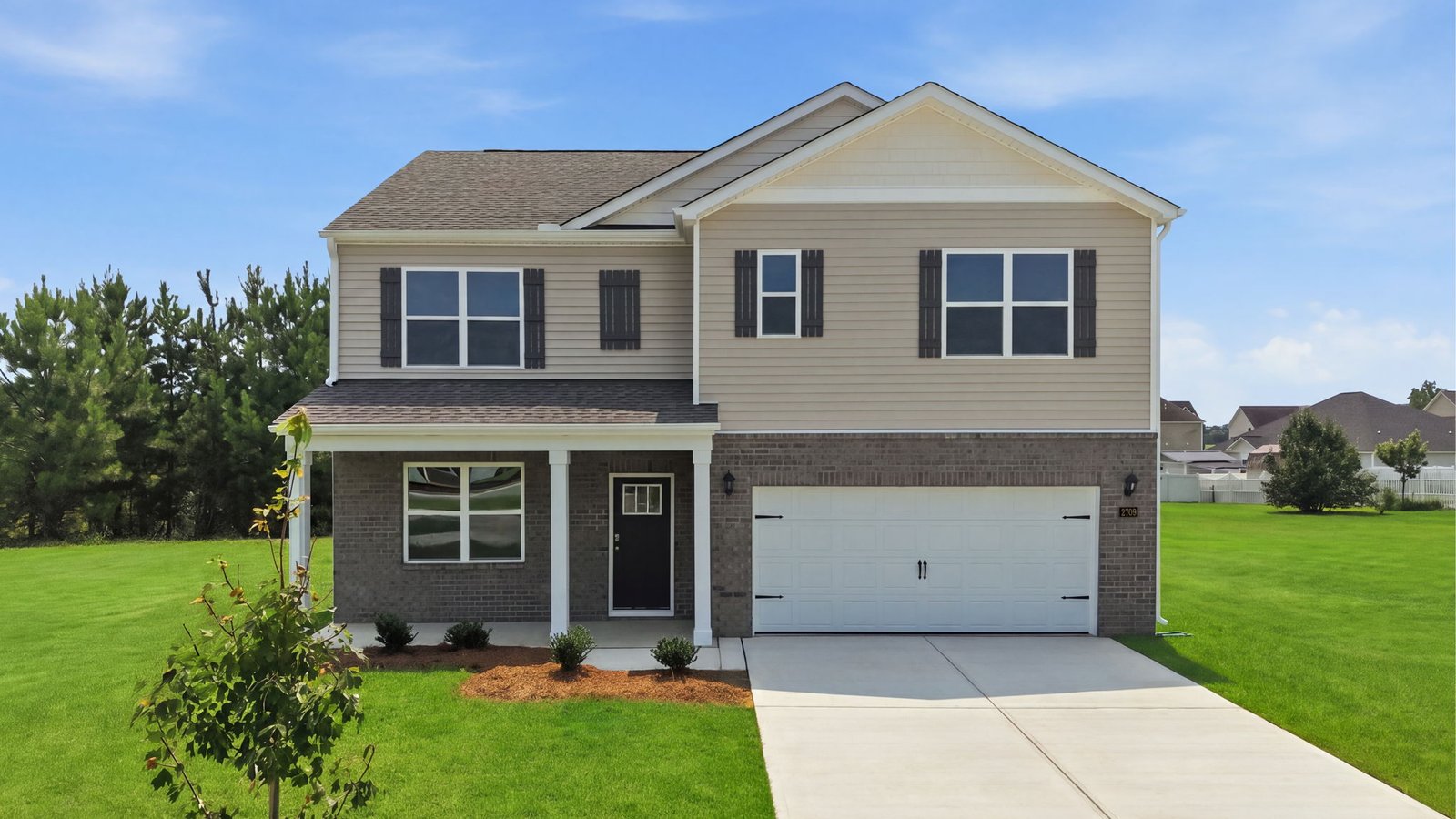 two story home with brick and vinyl