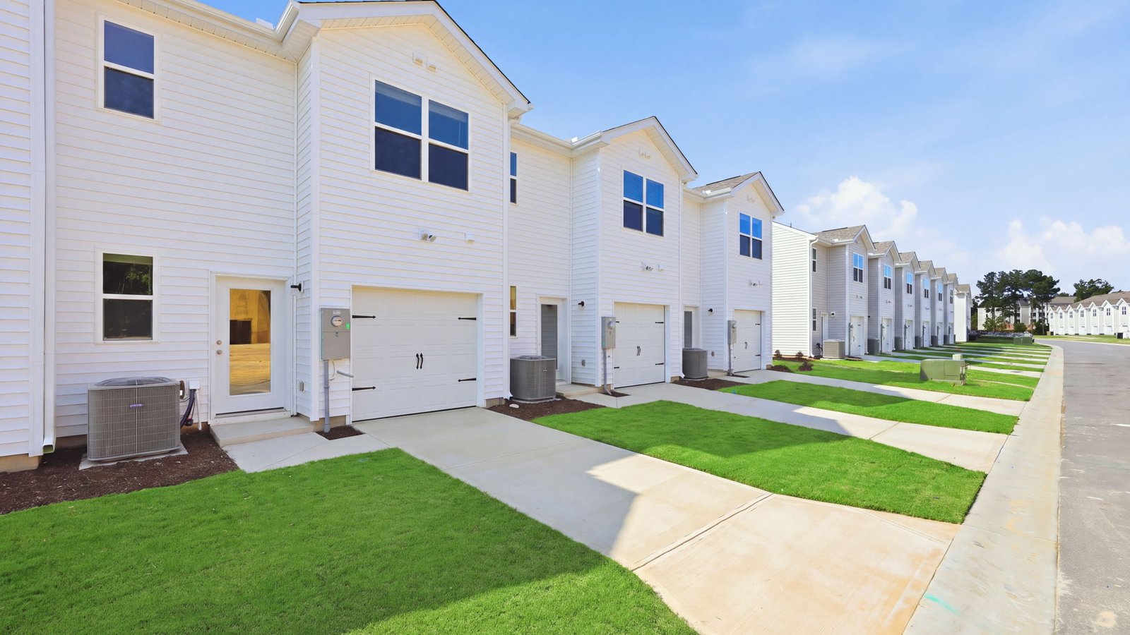 rear view of two story townhome