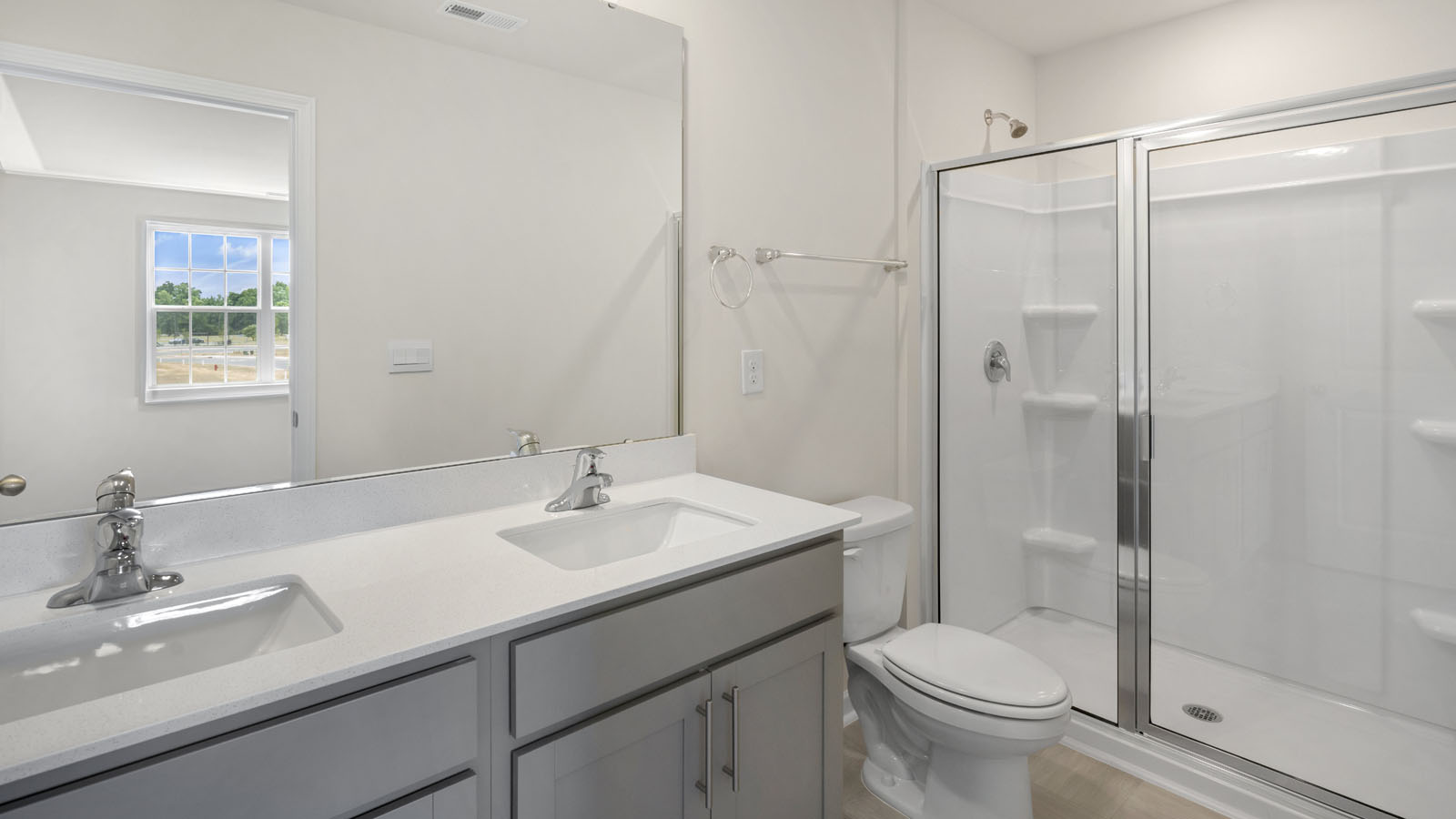 Bathroom with grey cabinets