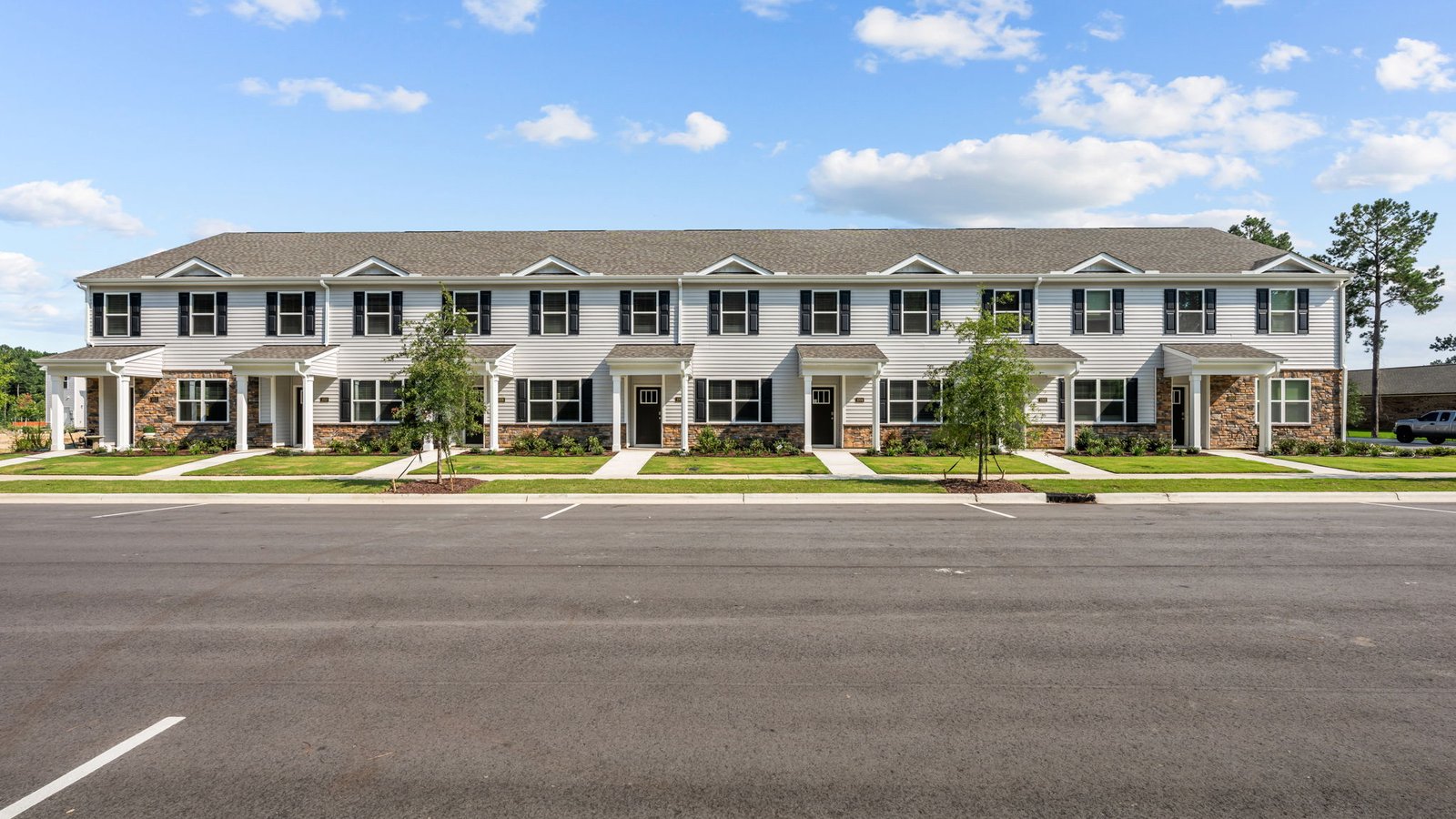 Two story townhomes with brick and vinyl