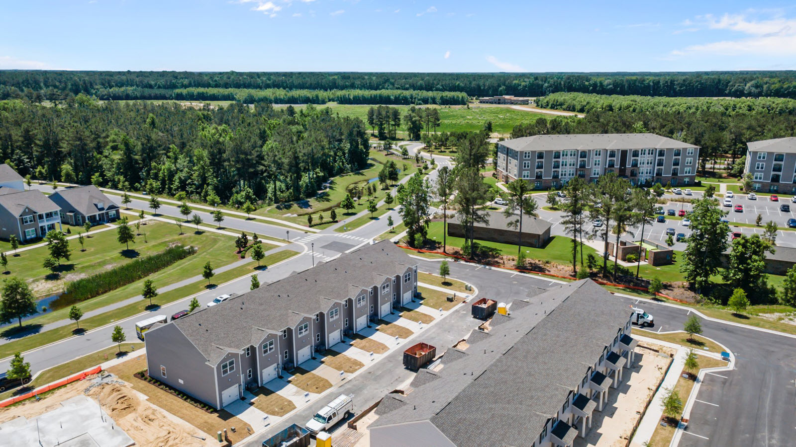 aerial view of the townhomes in the community featuring a garage in the back of the home