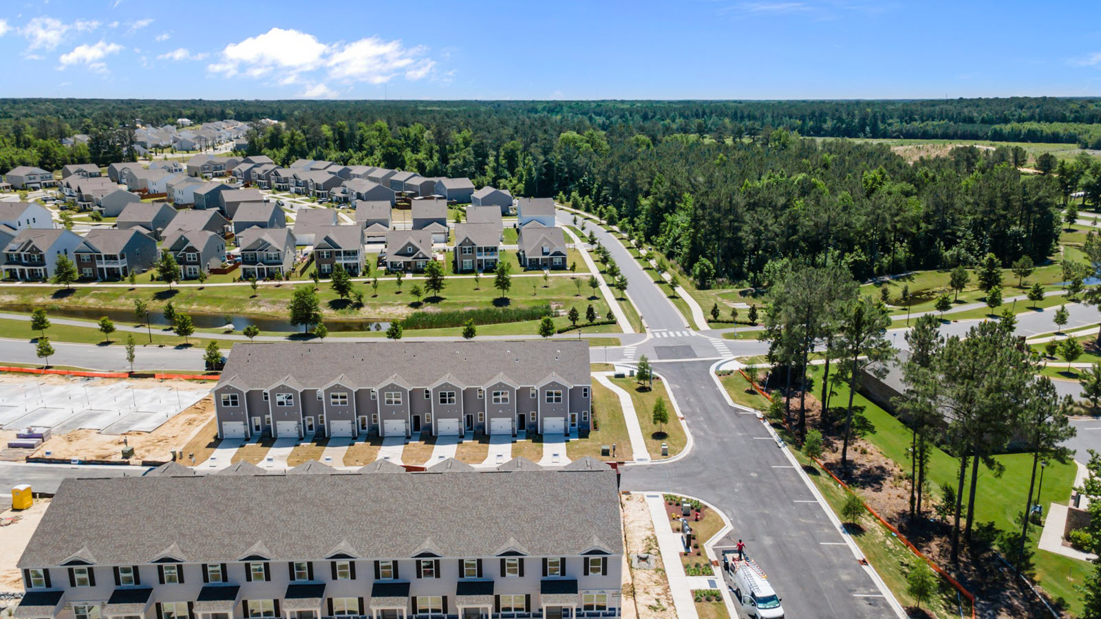 aerial view of the townhomes in the community featuring a garage in the back of the home