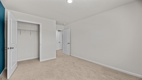 bedroom overlooking the closet and hallway