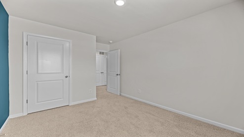 bedroom overlooking the closet and hallway
