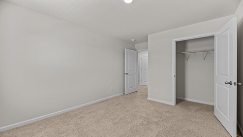 bedroom overlooking the closet and hallway