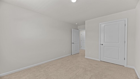 bedroom overlooking the closet and hallway