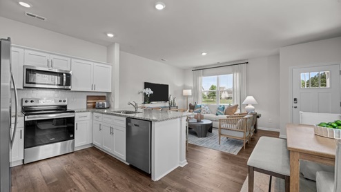 view of kitchen with white cabinets and stainless steel appliances