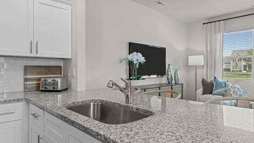 view of kitchen with white cabinets and stainless steel appliances