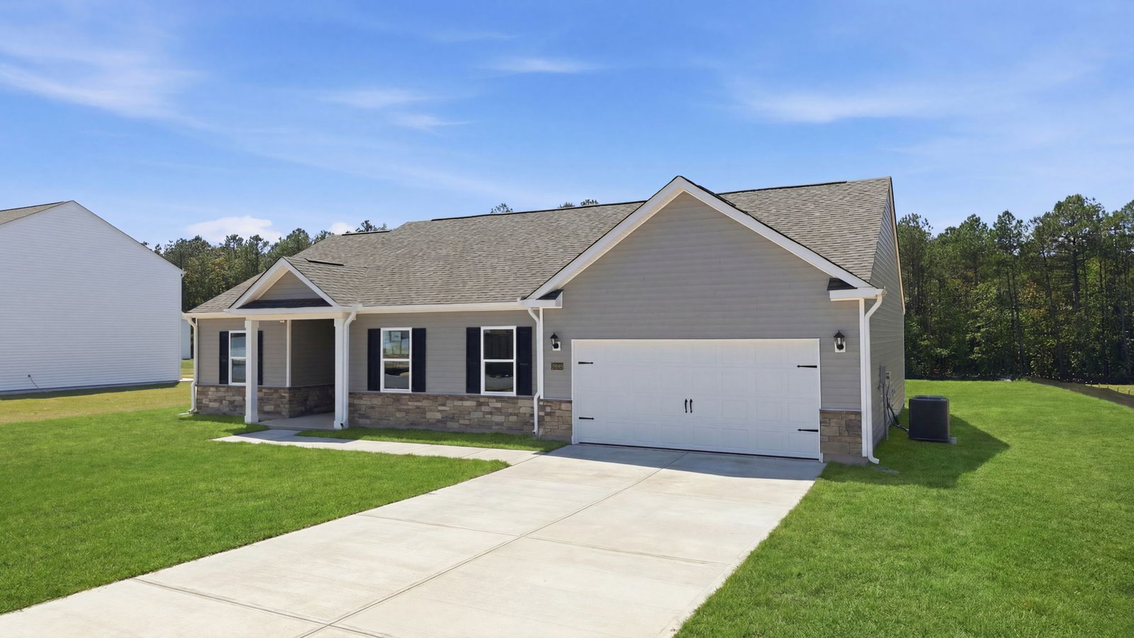 exterior of garage with driveway and two car garage