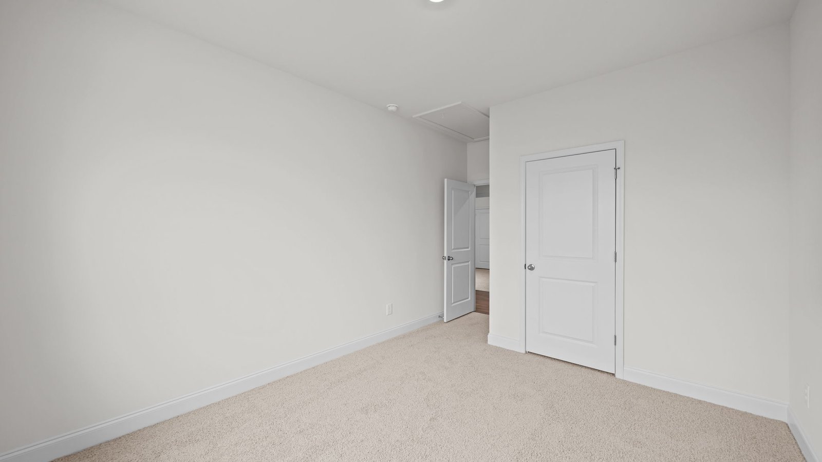 carpeted secondary bedroom
