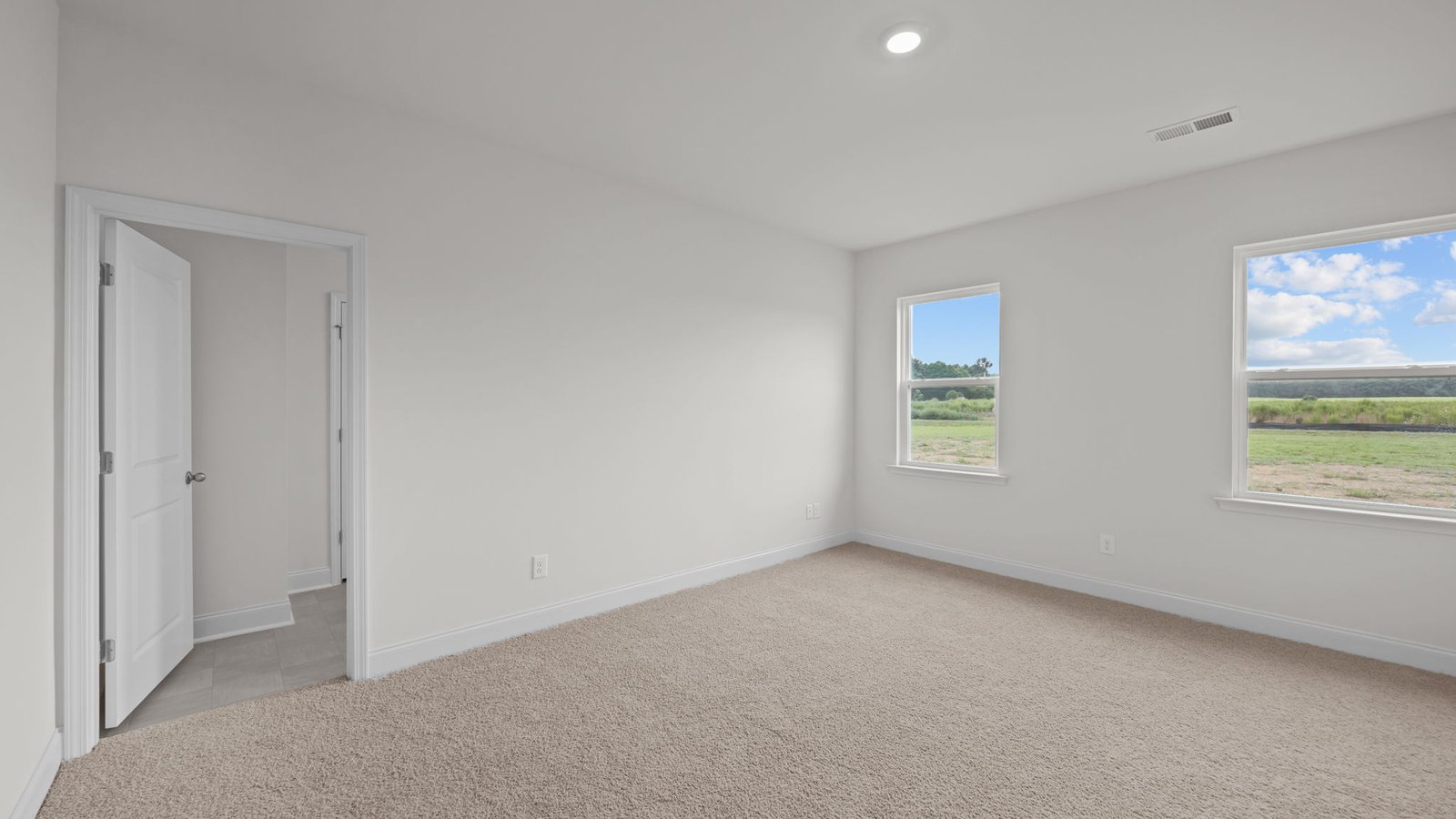 primary bedroom with windows