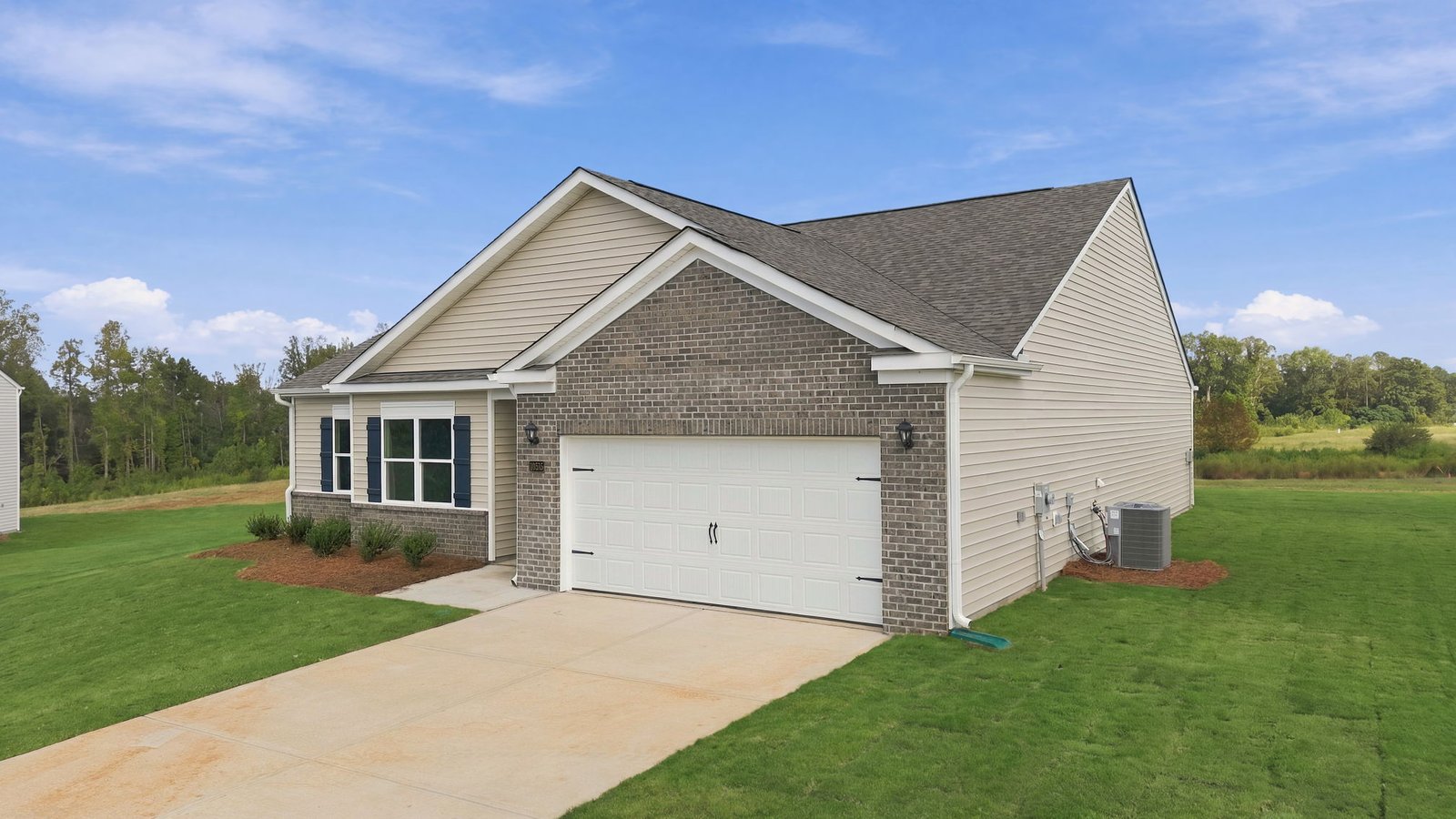 front view of single story family home with two car garage