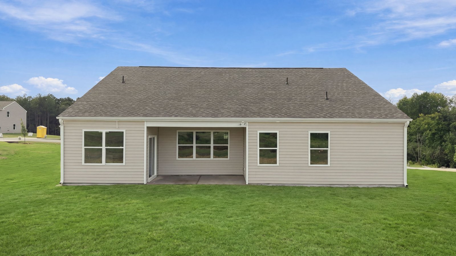 rear view of home with covered back patio