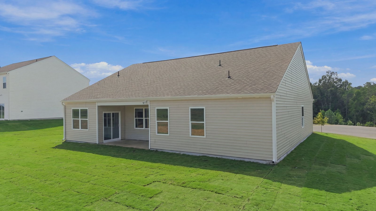 rear view of home with covered back patio