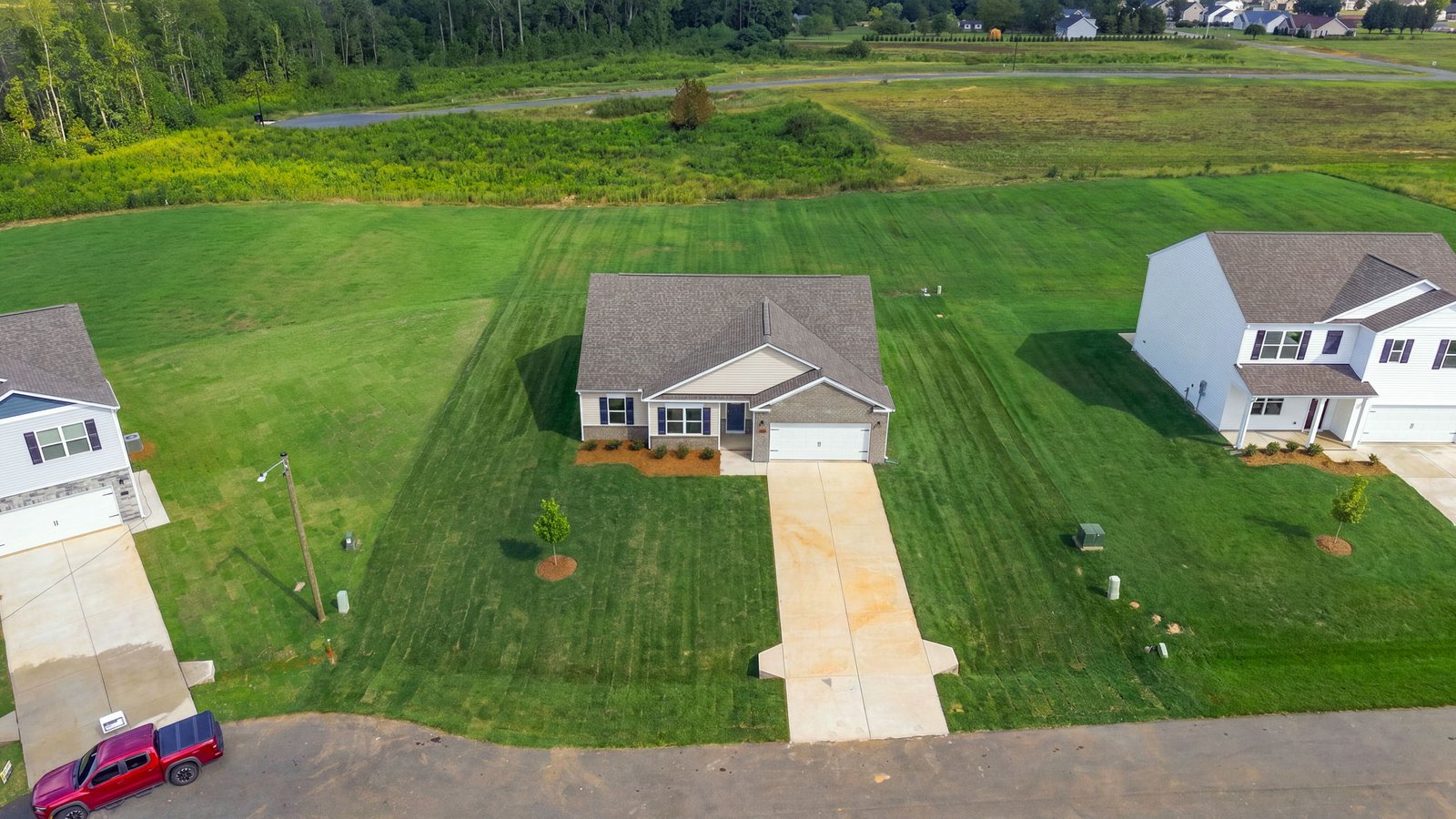 aerial view of home and lot