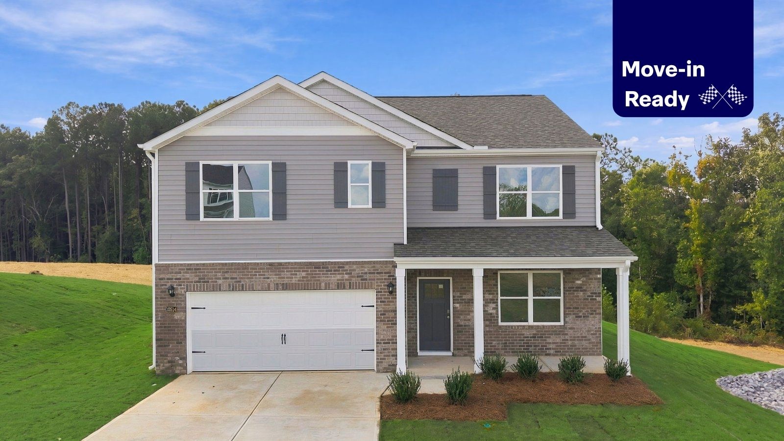 front view of two story home with brick and vinyl