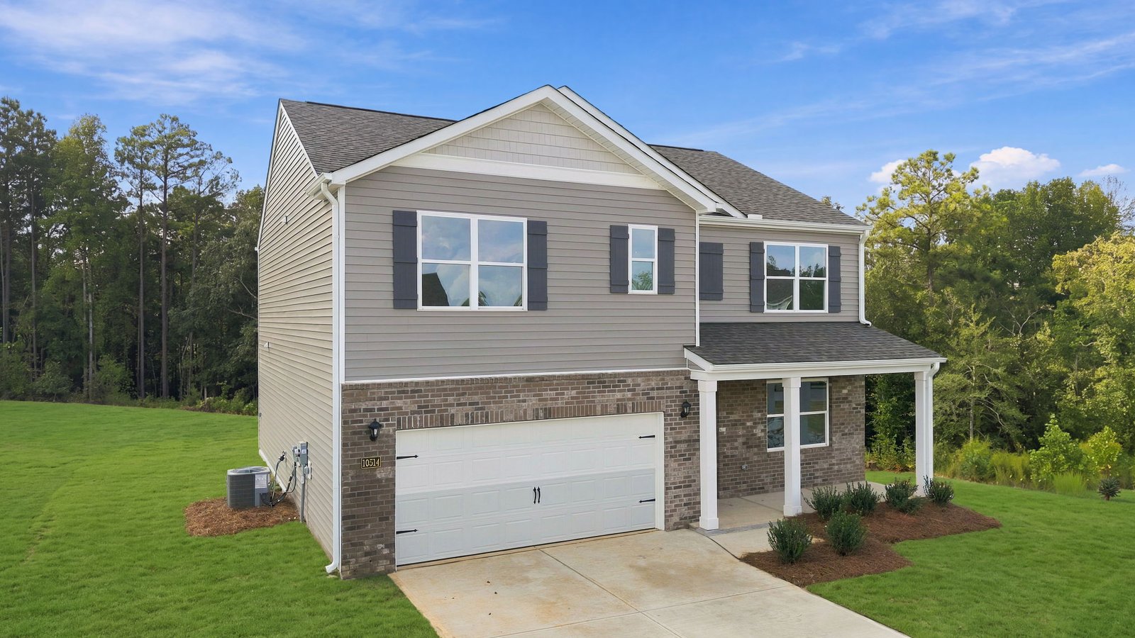 two story home with two car garage