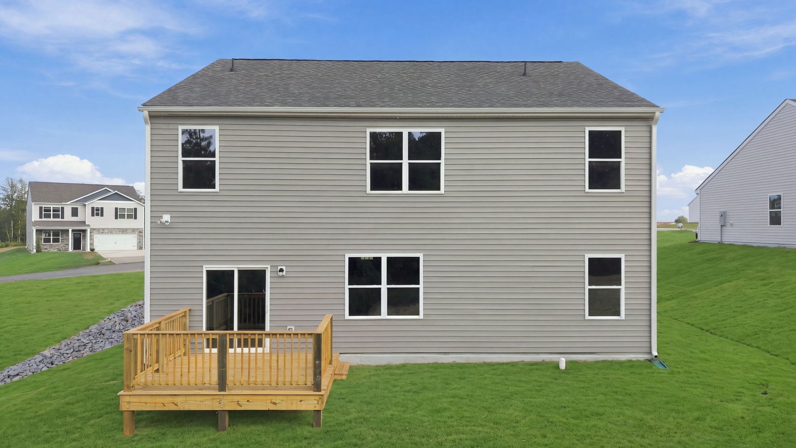 rear view of two story home and lot