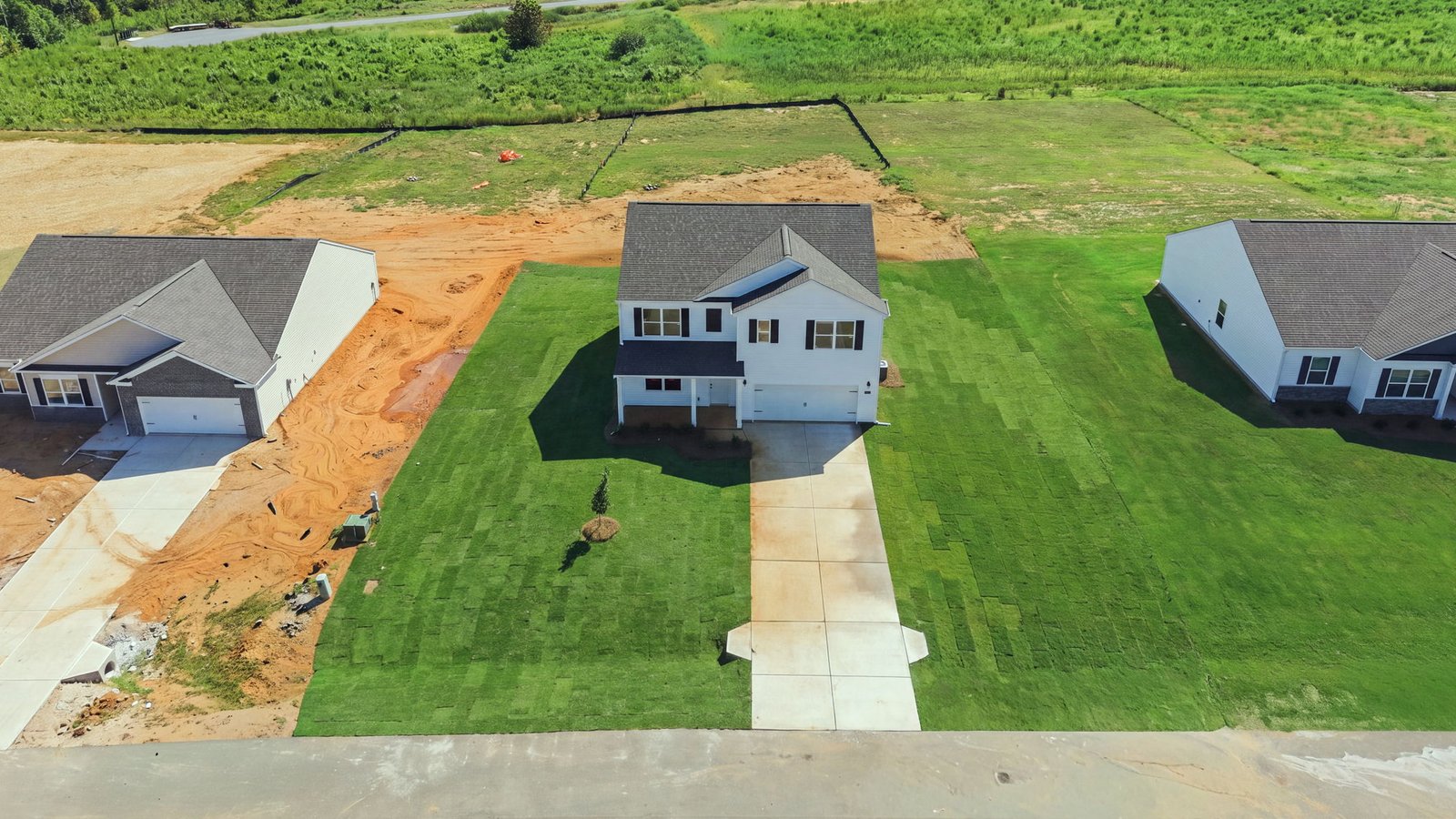 aerial view of home and lot