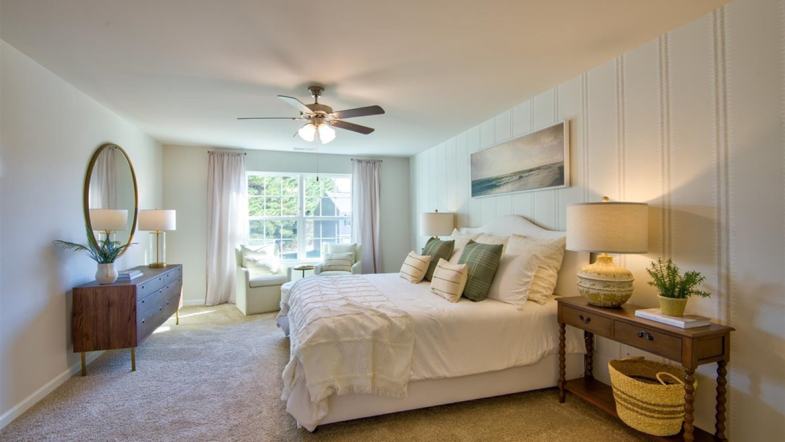 Primary bedroom with carpet flooring