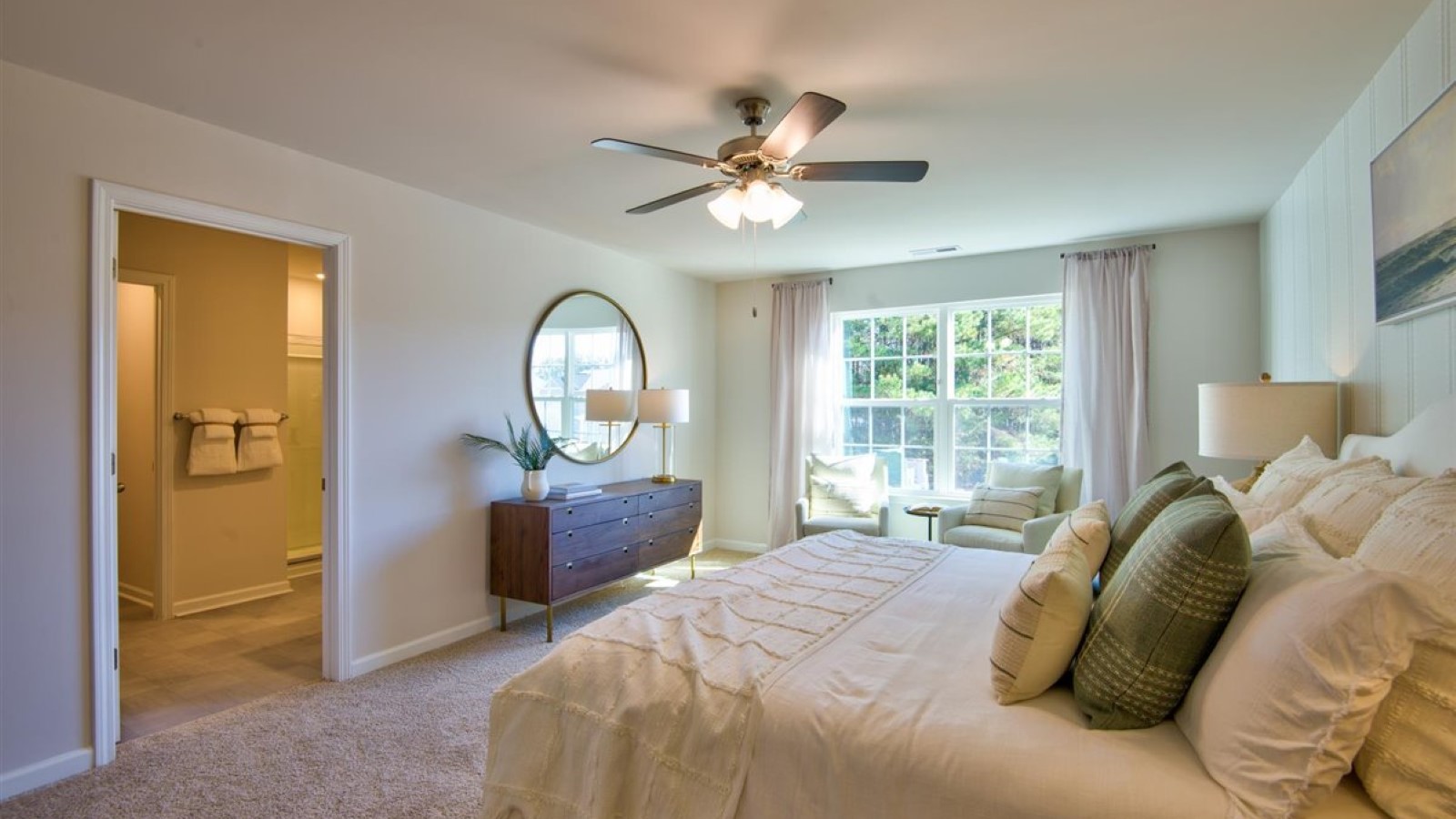 Primary bedroom with carpet flooring