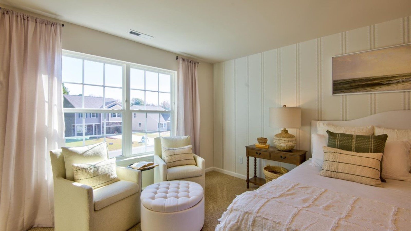 Primary bedroom with carpet flooring